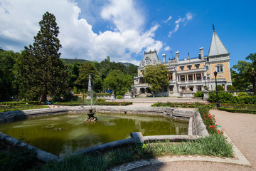 the pond in front of the old Palace in the summer sun. Massandra Palace residence of Emperor...