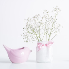 Pink birdie stand with white gypsophila. White background