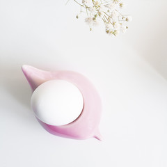 White Egg in Pink Bird Shape Stand. Top View