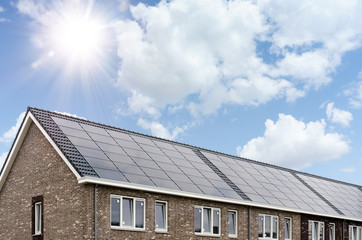 Fototapeta na wymiar Dutch roof with solar panels