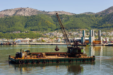 Dredge ship on the sea on the Igoumenitsa port in the Greece. Thesprotia.
