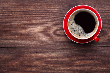 Cup of coffee on brown wooden table