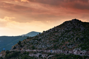 Serpentine road, sunset view. Amazing Mountain sunset. Journey through the Montenegro mountains