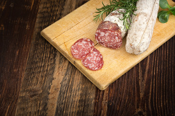  Dried salami with rosemary and basil.