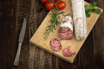  Dried salami with rosemary, basil and tomatoes.