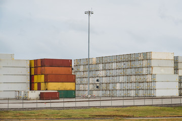 stacked container at harbor - import export concept
