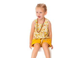 Fashionable little girl in beads.