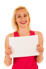Fototapeta premium Active sporty woman holds white banner with copy space for additional text or graphic isolated over white background