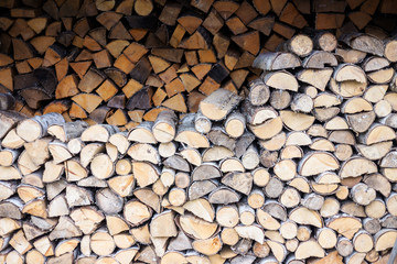Piles of chopped firewood for winter
