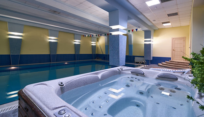 Indoors swimming pool in modern gym fitness spa - obrazy, fototapety, plakaty