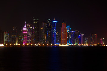 Skyline of West Bay skyscrapers, taken during night time from the Corniche. Doha, Qatar.