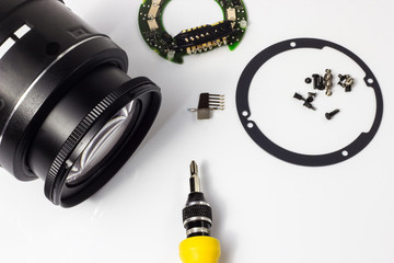 Disassembly and repair of a photo lens, cleaning the glass.