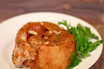 food baked fat in spices on a plate
