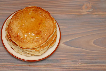 food, pancakes on a plate of milk and honey