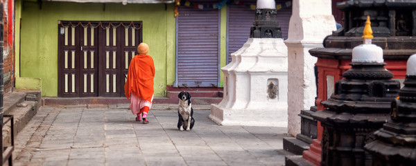 Praying woman in a Buddhist temple. Kathmandu, Nepal