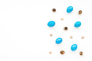 Blue Easter eggs and quail eggs on white background. Flat lay, top view