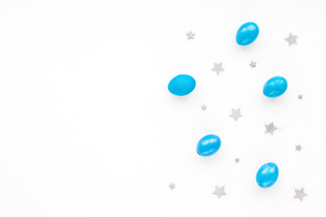 Blue easter eggs on white background. Flat lay, top view