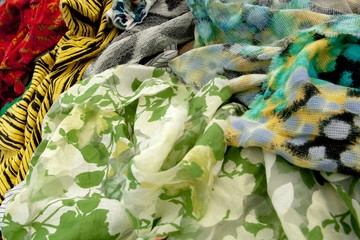 green crinkled textile with leaf motive and red flower for background wallpaper spring