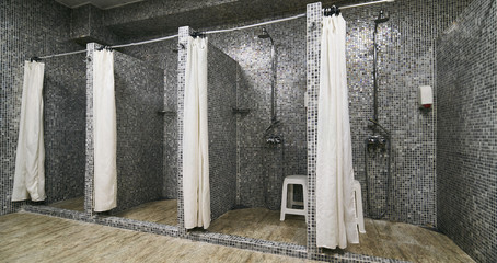 Empty Showers in modern Gym Locker Room