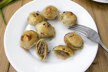 Fried dumplings on a plate.