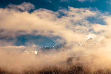Mangart capped by the fog in a winter day