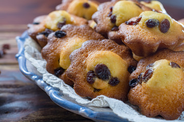 Traditional homemade French butter muffins stars with raisins, tasty dessert