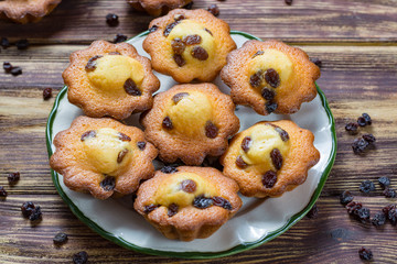 Traditional homemade French butter muffins stars with raisins, tasty dessert