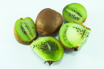 Sliced juicy green kiwi on white background