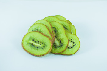 Sliced juicy green kiwi on white background