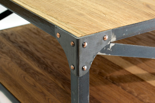 Iron corner with rivets.