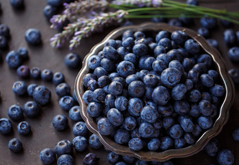 Fresh Organic Blueberries in an Antique Bowl by Window Light