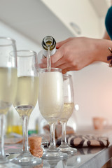 The girl pours champagne