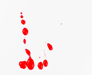 Puddles of blood on a white background.