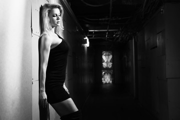 A pretty woman in a dark room