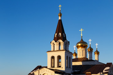 Fototapeta na wymiar Orthodox christian church in Nizhny Novgorod city in Russia at winter sunset