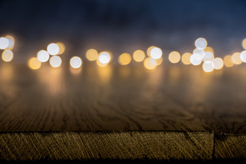 wooden background with blur bokeh. flashlights.