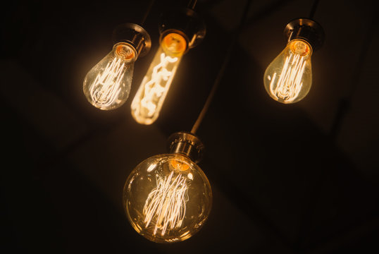 Edison vintage retro light bulb lamp lantern at dark. Art detail decor of interior