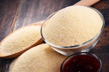 Bowl of semolina on wooden table