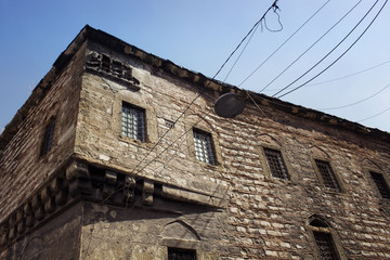 Fototapeta na wymiar Bottom view of historical, stone building in Eminonu/Sirkeci area of Istanbul.