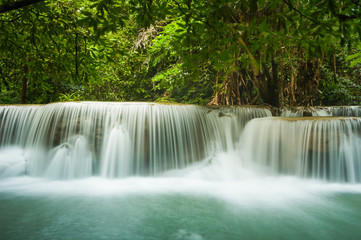 Fototapeta na wymiar Beautiful and Breathtaking green waterfall, Erawan's waterfall, Located Kanchanaburi Province, Thailand