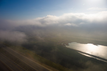 Beautiful clouds flying over the lake near mountains. Evening time shot over the clouds. Baku, Azerbaijan