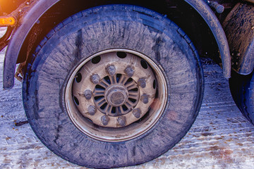 the wheel of the truck on the winter road