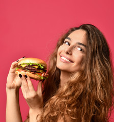Woman hold barbecue burger sandwich with hungry mouth on pink red background