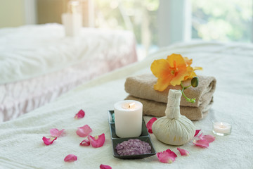 Beauty and fashion concept with spa set.Spa feet and hand thai massage compress balls,herbal ball on the wooden with treatments spa,summer day,Thailand.