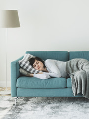 Obraz premium Woman sleeping on the sofa