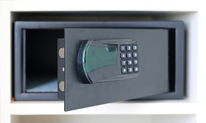 Fototapeta premium Open a safe hidden in the wardrobe at the hotel.