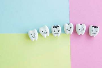cute cartoon healthy and decayed teeth icon on pastel backdrop for kid education