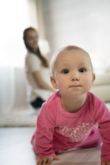 young mother plays with a baby.