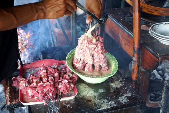 Satay making process at Yogyakarta,  Indonesia. Sate klathak is a unique goat satay dish, originally from Pleret District, Bantul Regency in Yogyakarta.