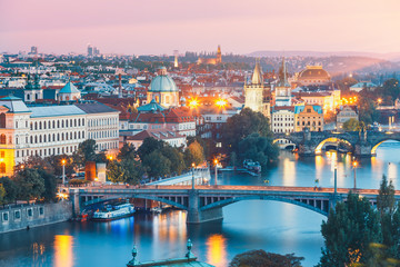 Fototapeta na wymiar bridges with historic Charles Bridge and Vltava river at night in Prague, Czech Republic